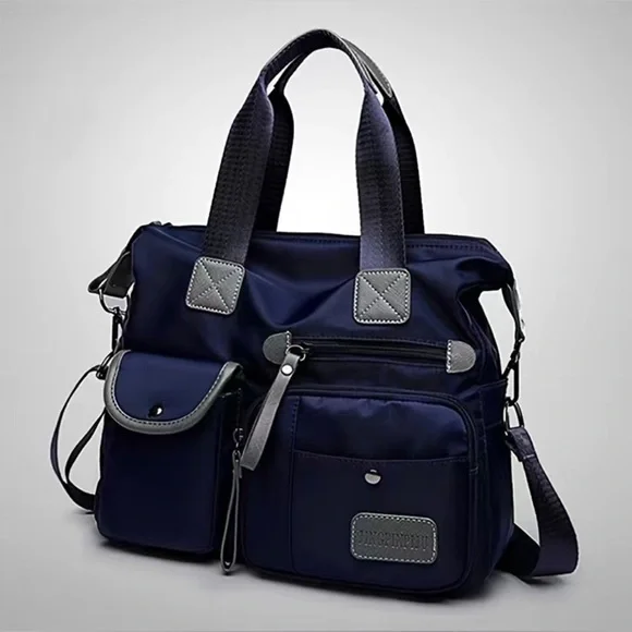 Sweet heaven! It a large, fashionable NYLON bag with lots of compartments! - Picture 6 of 6